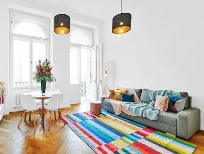 a living room with a couch and a table at Pytloun Bristol Residence Prague in Prague