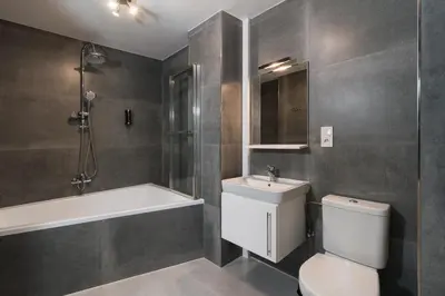 a bathroom with a toilet and a sink and a bath tub at Prague Old Town Liliova Garden in Prague