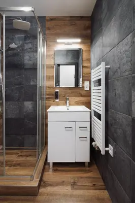a bathroom with a white sink and a shower at Prague Old Town Liliova Garden in Prague