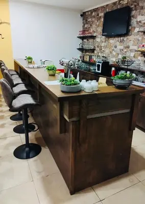 a kitchen with a counter with bowls of food on it at Hotel & wellness Hejtmanka in Mladá Boleslav