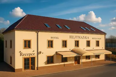 a large white building with a red roof at Hotel & wellness Hejtmanka in Mladá Boleslav