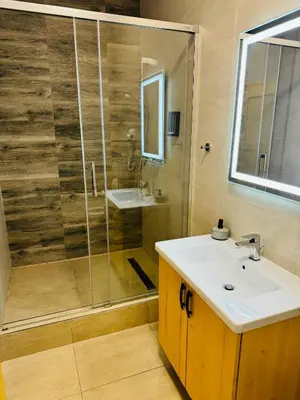 a bathroom with a sink and a shower at Hotel & wellness Hejtmanka in Mladá Boleslav