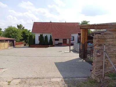 a house with a gate in front of it at Bohemica Apartman 4 in Kouřim