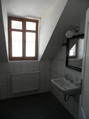 a bathroom with a sink and a window at Time Cafe & Penzion in Příbram
