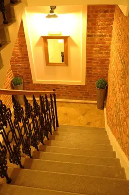 a staircase in a building with a mirror at Time Cafe & Penzion in Příbram