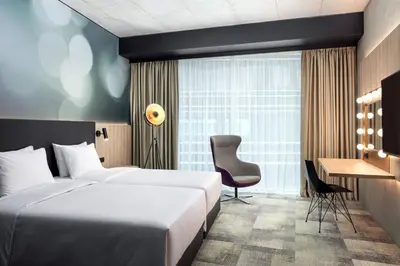 a hotel room with a bed and a desk at STAGES HOTEL Prague, a Tribute Portfolio Hotel in Prague