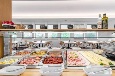 a buffet line with many different types of food at Botel Racek in Prague