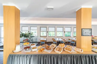 a buffet of food on a table in a cafeteria at Botel Racek in Prague