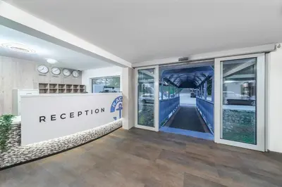 a reception area of a restaurant with glass doors at Botel Racek in Prague