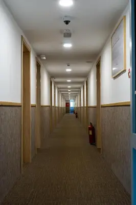 a hallway of an office building with a long aisle at Botel Racek in Prague