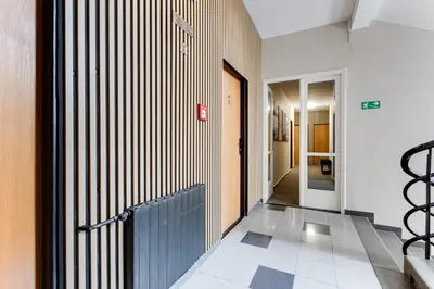 a hallway with a gate in a building at Hotel Andante in Prague