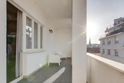 a balcony with a view of a building at Hotel Andante in Prague