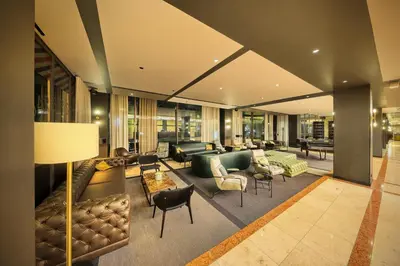 a large living room with couches and chairs at Diplomat Hotel Prague in Prague