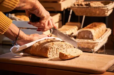 a table with a cutting board with bread and baskets at Jalta Boutique Hotel in Prague