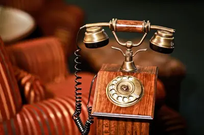 an old fashioned telephone is sitting on a couch at Hotel Julian in Prague