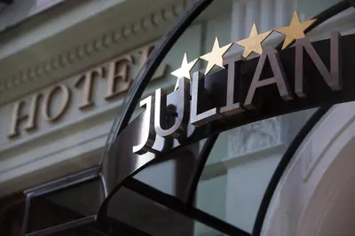 a sign on the side of a building with stars on it at Hotel Julian in Prague