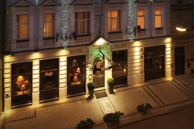 an image of a hotel at night with lights at Hotel Julian in Prague