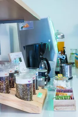 a counter with containers of seeds on a counter top at Hotel Meda of Museum Kampa in Prague