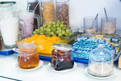 a counter with jars of food and other food items at Hotel Meda of Museum Kampa in Prague