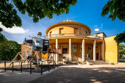 a building with a playground in front of it at Expo Hotel in Prague