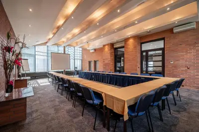 a conference room with a long table and chairs at Expo Hotel in Prague
