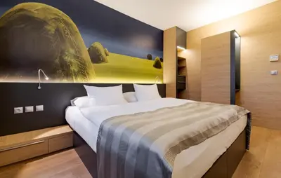 a bedroom with a large bed in a room at Expo Hotel in Prague
