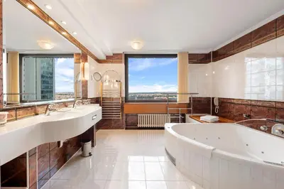 a large bathroom with two sinks and a large tub at Panorama by Verdi Hotels in Prague