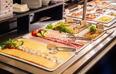 a buffet line with many different types of food at Hotel Elite Prague in Prague