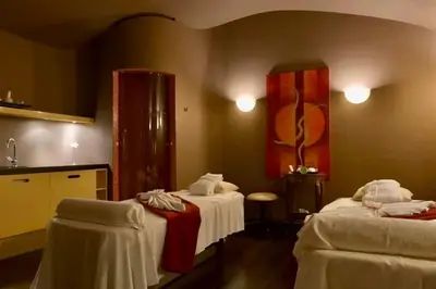 a room with paintings on the wall with a counter at Le Palais Art Hotel Prague in Prague