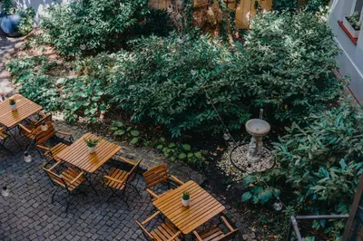 an overhead view of a patio with tables and chairs at Hotel Adler - Czech Leading Hotels in Prague