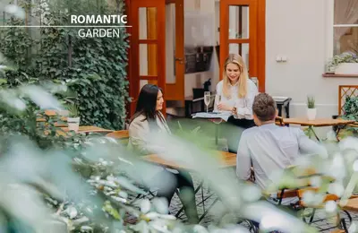 a group of people sitting at a table at Hotel Adler - Czech Leading Hotels in Prague
