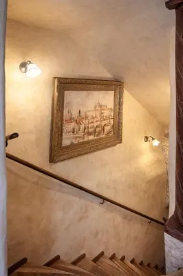 a painting of a city on a wall at The Charles in Prague