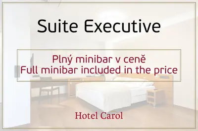 a white bed in a room with the words hotel caradj at Hotel Carol in Prague