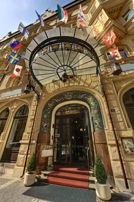 an entrance to a building with flags on it at Hotel Paris Prague in Prague