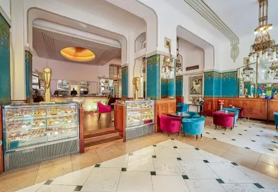 a store with pink chairs in a room at Hotel Paris Prague in Prague