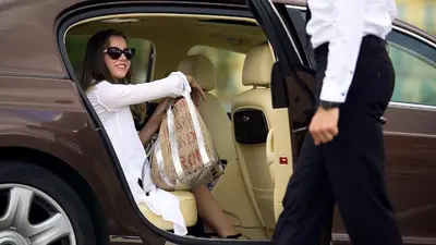 a woman sitting in the back of a car at Hotel Bologna in Prague