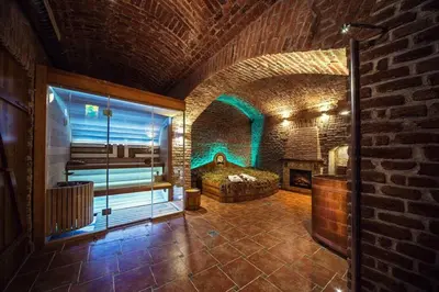 a large room with a bed and a fireplace at Hotel Suite Home Prague in Prague