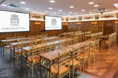 a restaurant with tables and chairs in a room at Iron Gate Hotel & Suites Prague by BHG in Prague