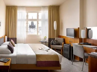 a hotel room with a bed and a desk at K+K Hotel Central in Prague