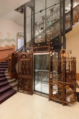 a lobby with a staircase and a glass door at K+K Hotel Central in Prague