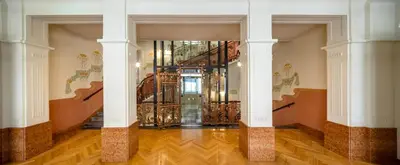 a hallway with a spiral staircase in a building at K+K Hotel Central in Prague