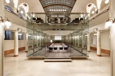 a large hall with a glass case in a building at K+K Hotel Central in Prague