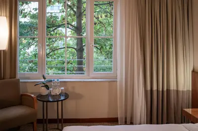 a hotel room with a bed and a window at K+K Hotel Central in Prague