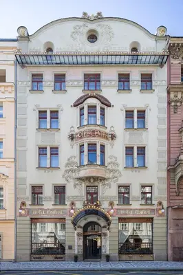 a large white building with a sign on it at K+K Hotel Central in Prague