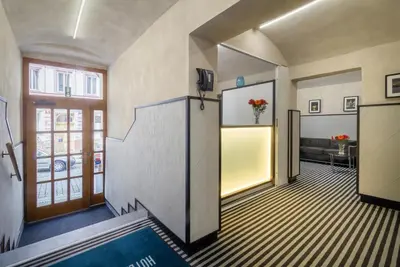 a hallway with an open door to a room at Hotel White Lion in Prague
