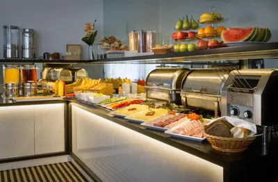 a buffet line with many different types of food at Hotel White Lion in Prague