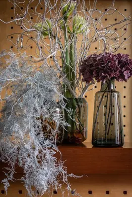 two vases sitting on a table with flowers in them at Art Hotel Prague in Prague