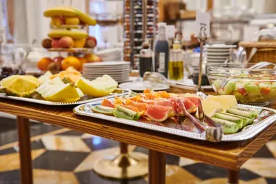 a table with two plates of food on it at Ventana Hotel Prague in Prague