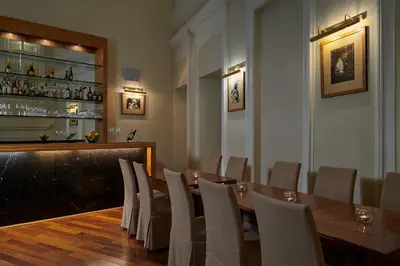 a dining room with a long table and chairs at Ventana Hotel Prague in Prague