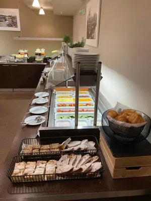 a buffet with different types of food on a table at Clarion Hotel Prague Old Town in Prague